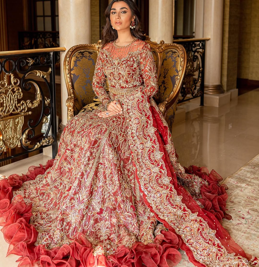 Luxury bridal lehnga choli in deep red with gold details by Mysie by Tahira