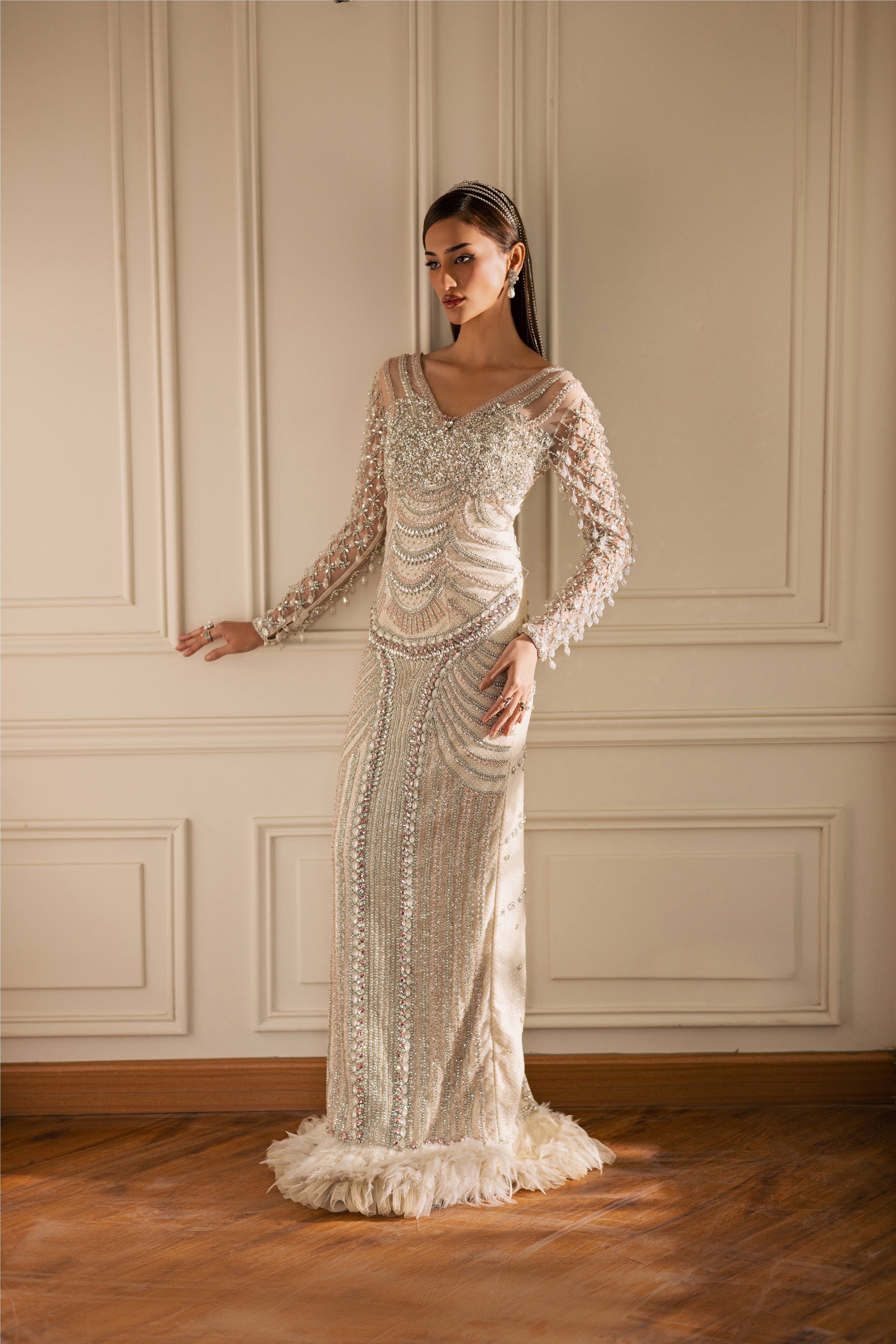 Hand-embellished Opal pearl-white luxury evening gown with sheer sleeves and crystals by Mysie By Tahira.