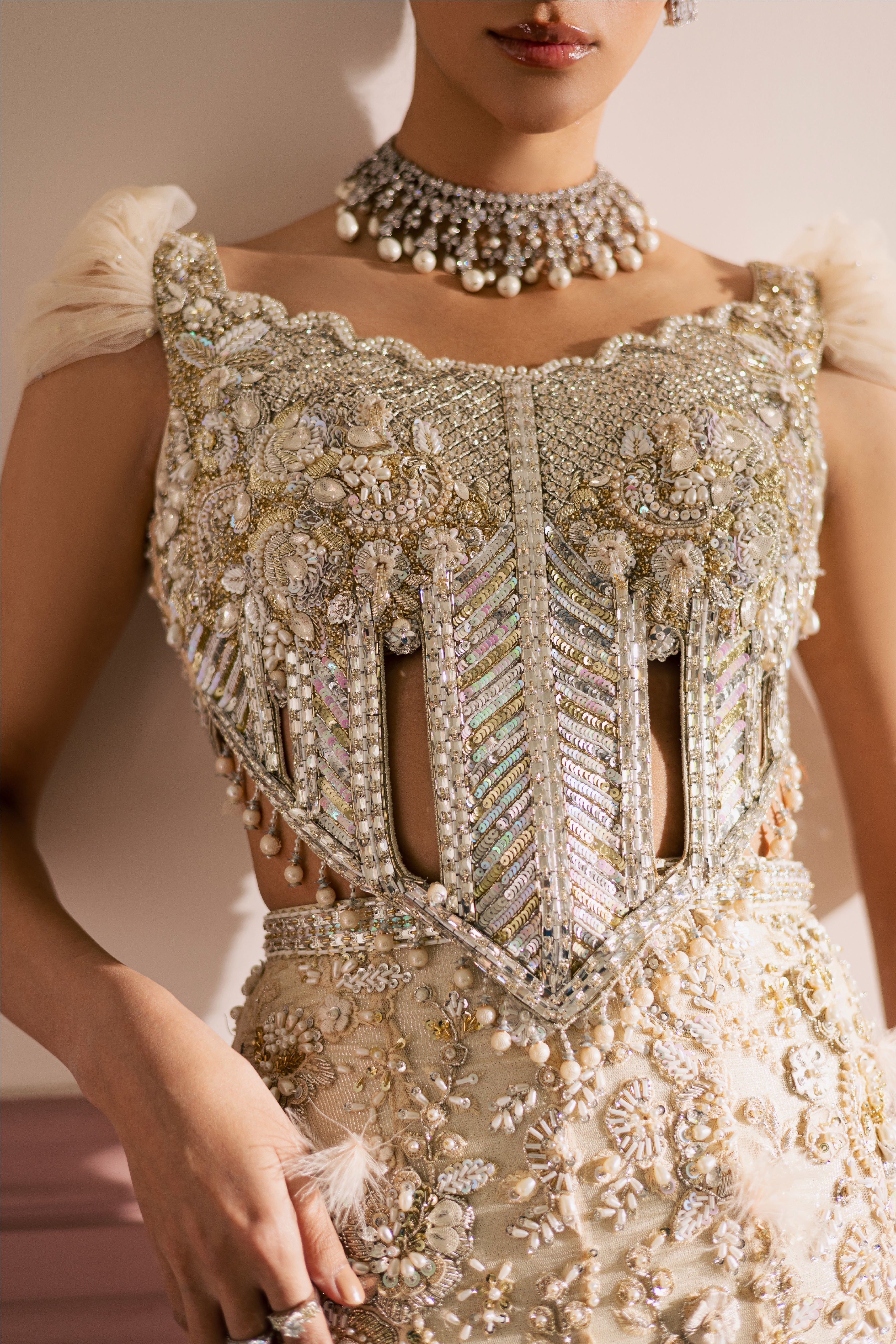 Beige-ivory luxury Radhika bridal lehenga with embellished choli and net dupatta by Mysie By Tahira.