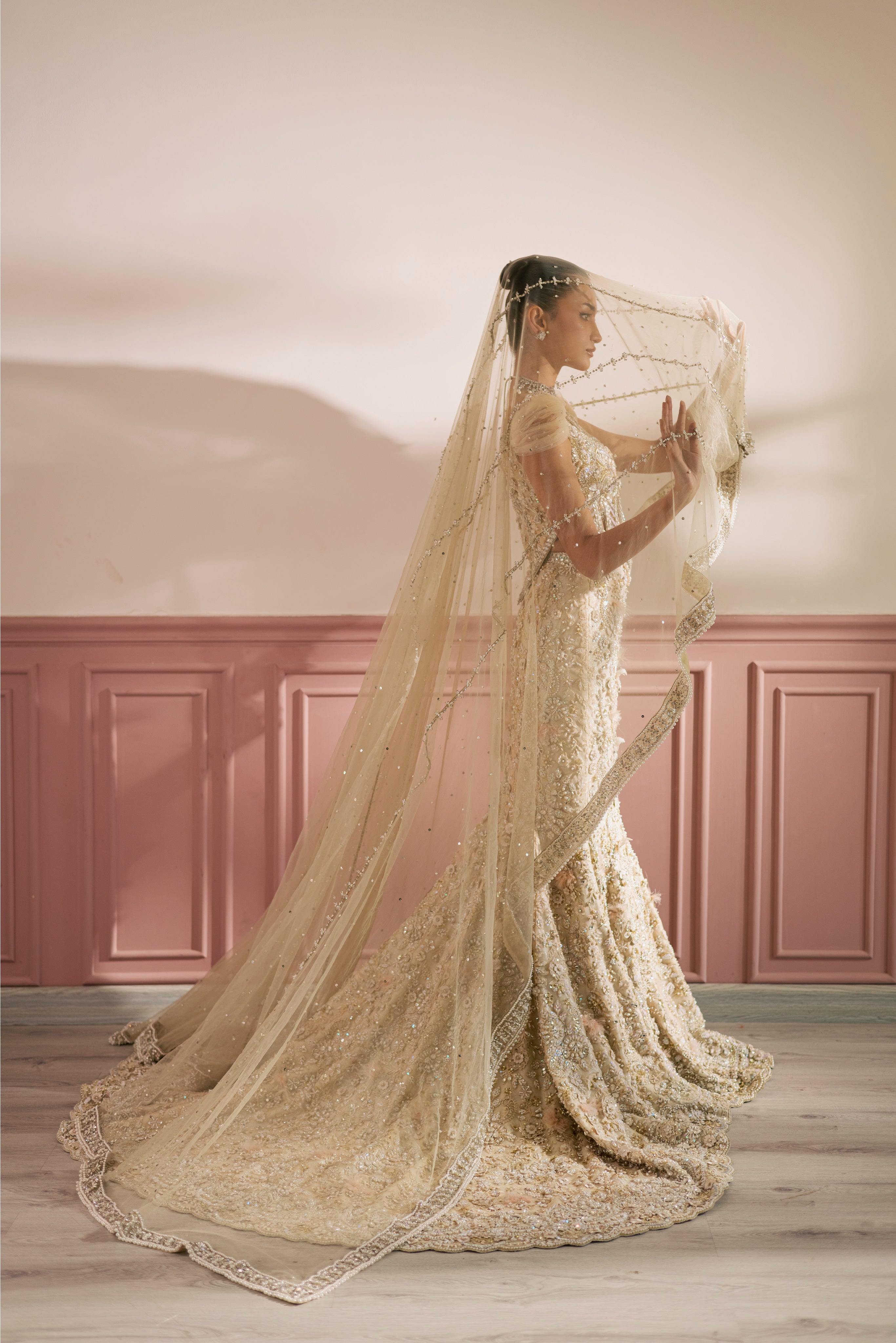 Beige-ivory luxury Radhika bridal lehenga with embellished choli and net dupatta by Mysie By Tahira.