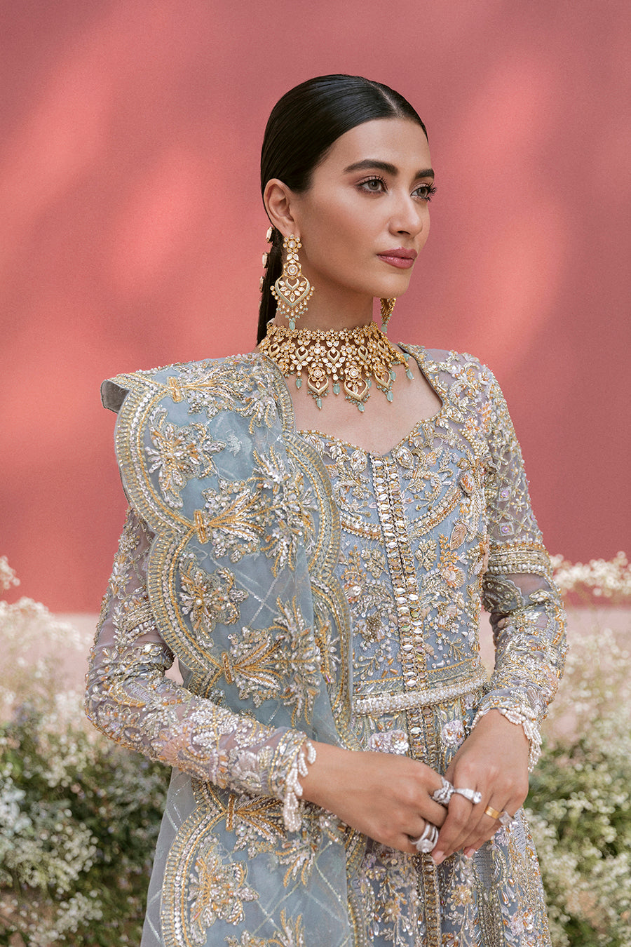 Pieta luxury Pakistani bridal outfit in ice blue organza with delicate embroidery and gold detailing.