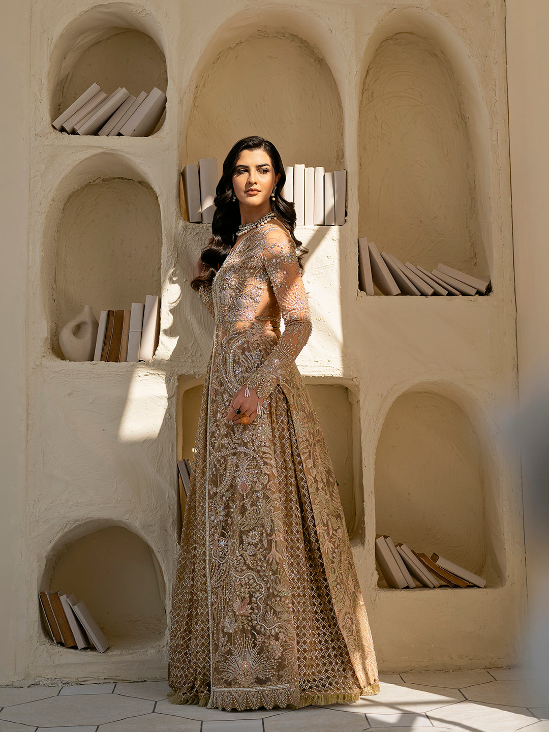 Ilama luxury formal outfit in muted peach and gold for Pakistani weddings.