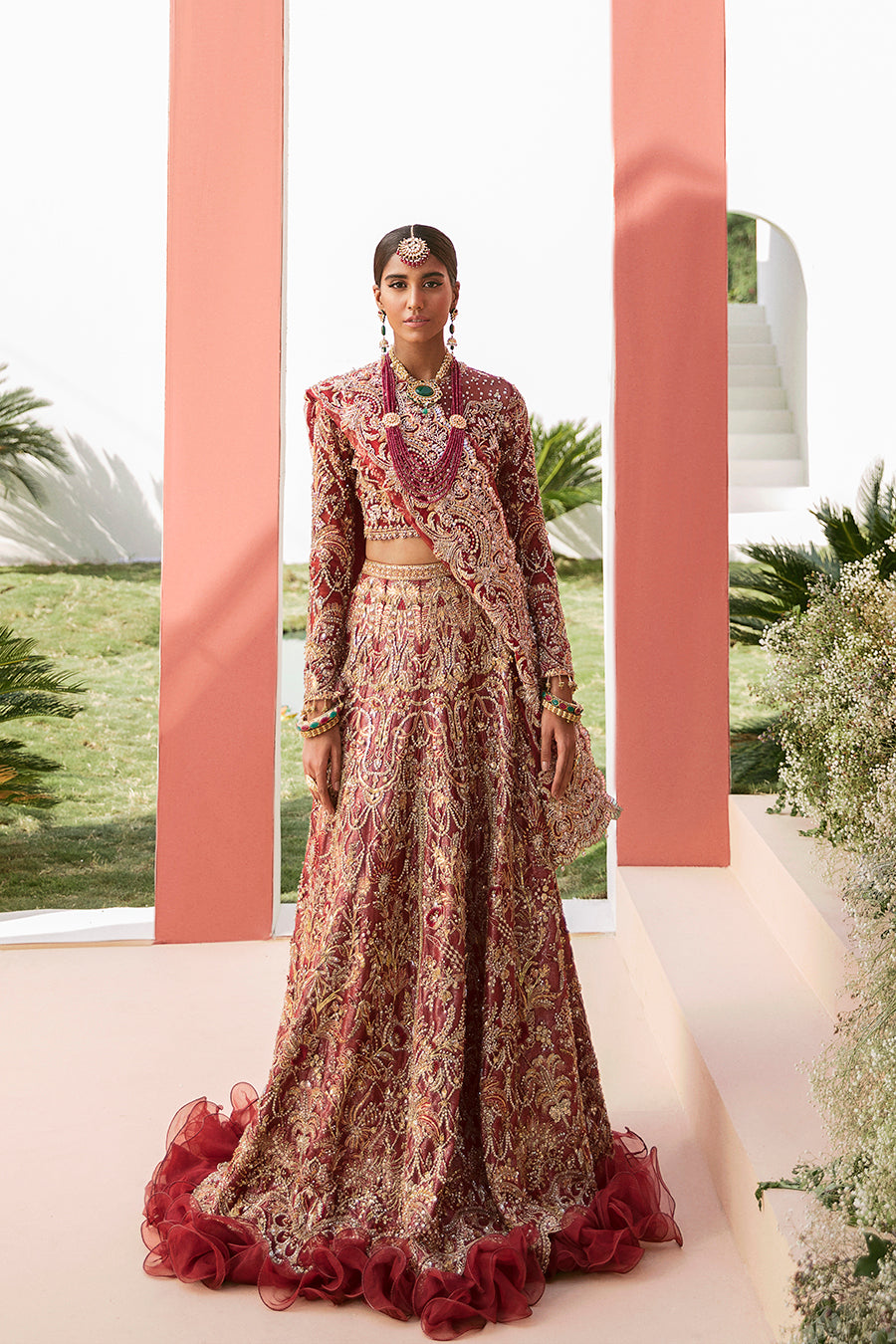 Luxury bridal lehnga choli in deep red with gold details by Mysie by Tahira