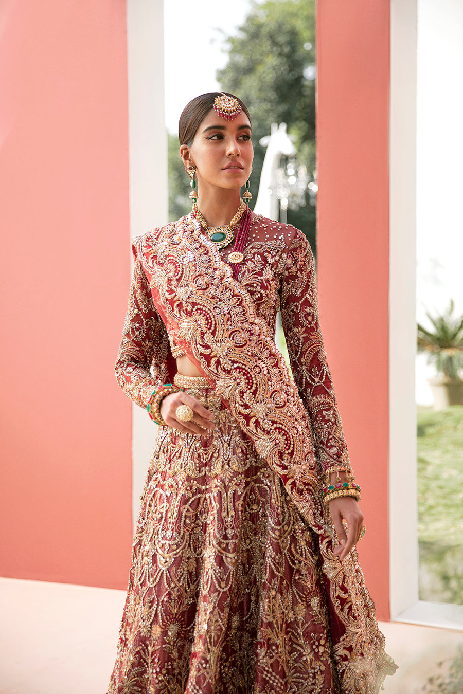 Luxury bridal lehnga choli in deep red with gold details by Mysie by Tahira