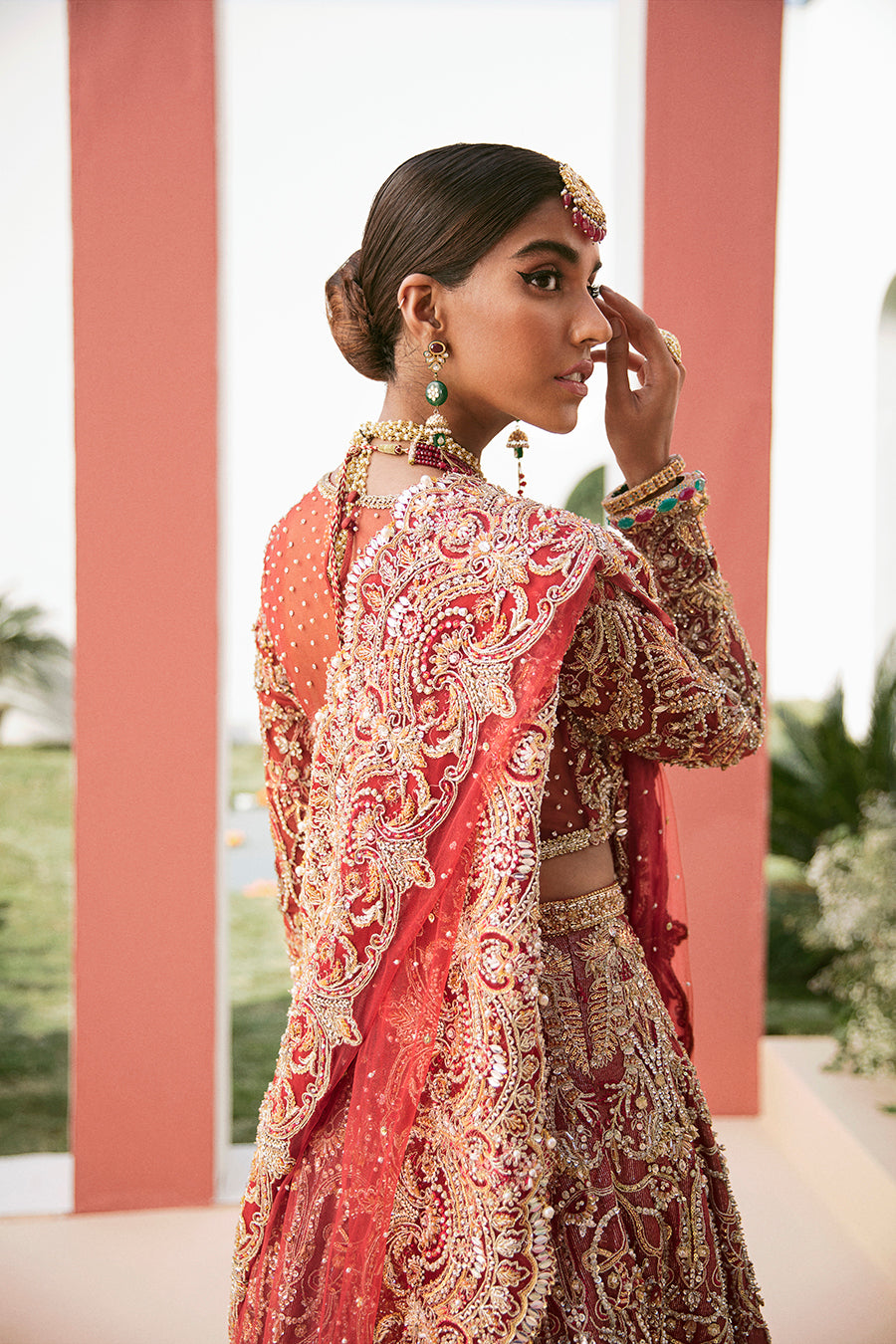 Luxury bridal lehnga choli in deep red with gold details by Mysie by Tahira
