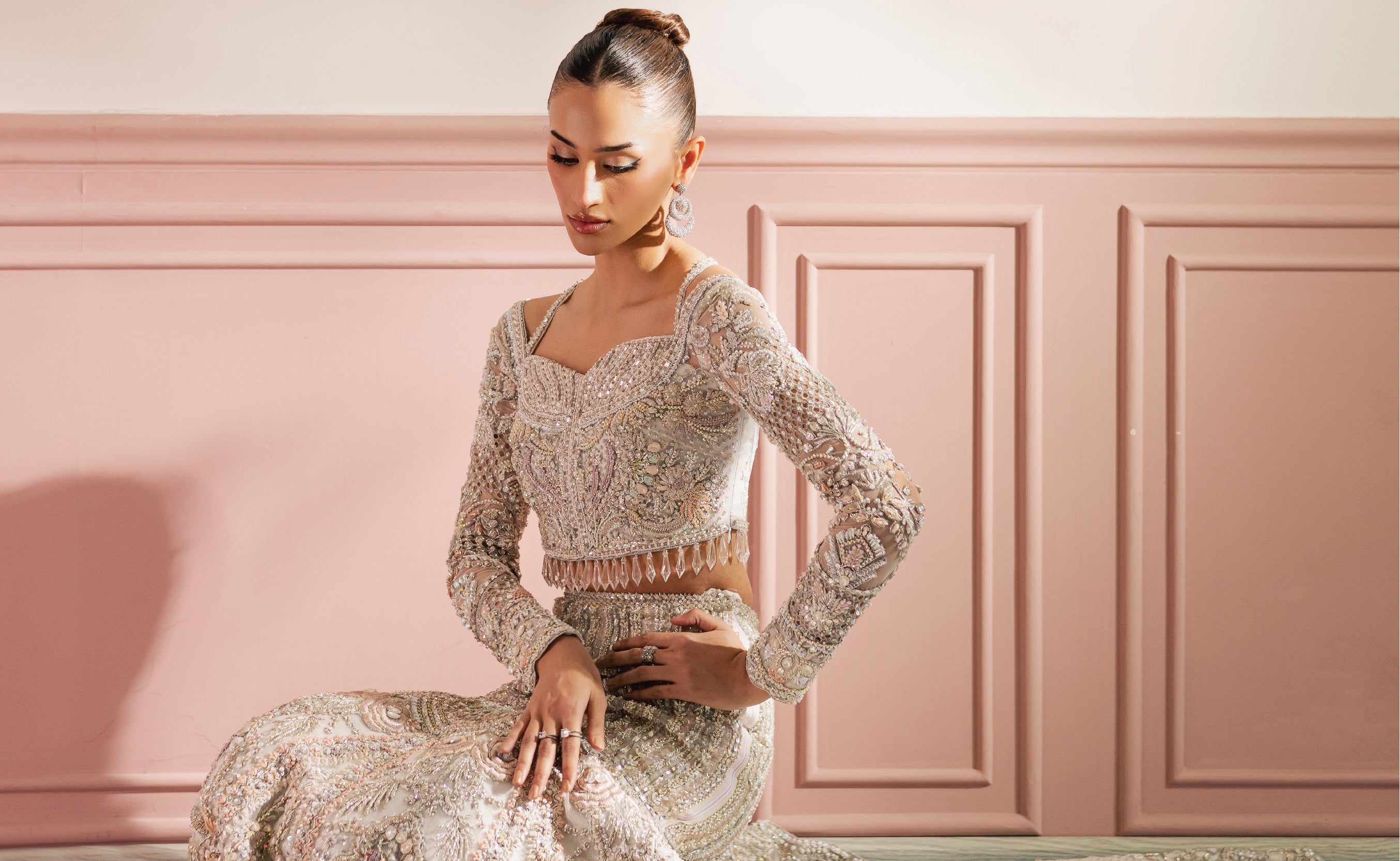 High-end Pakistani designer collection Arzu’25 featuring hand-embellished couture lehengas, tissue shararas, and net dupattas in modern pastel tones.