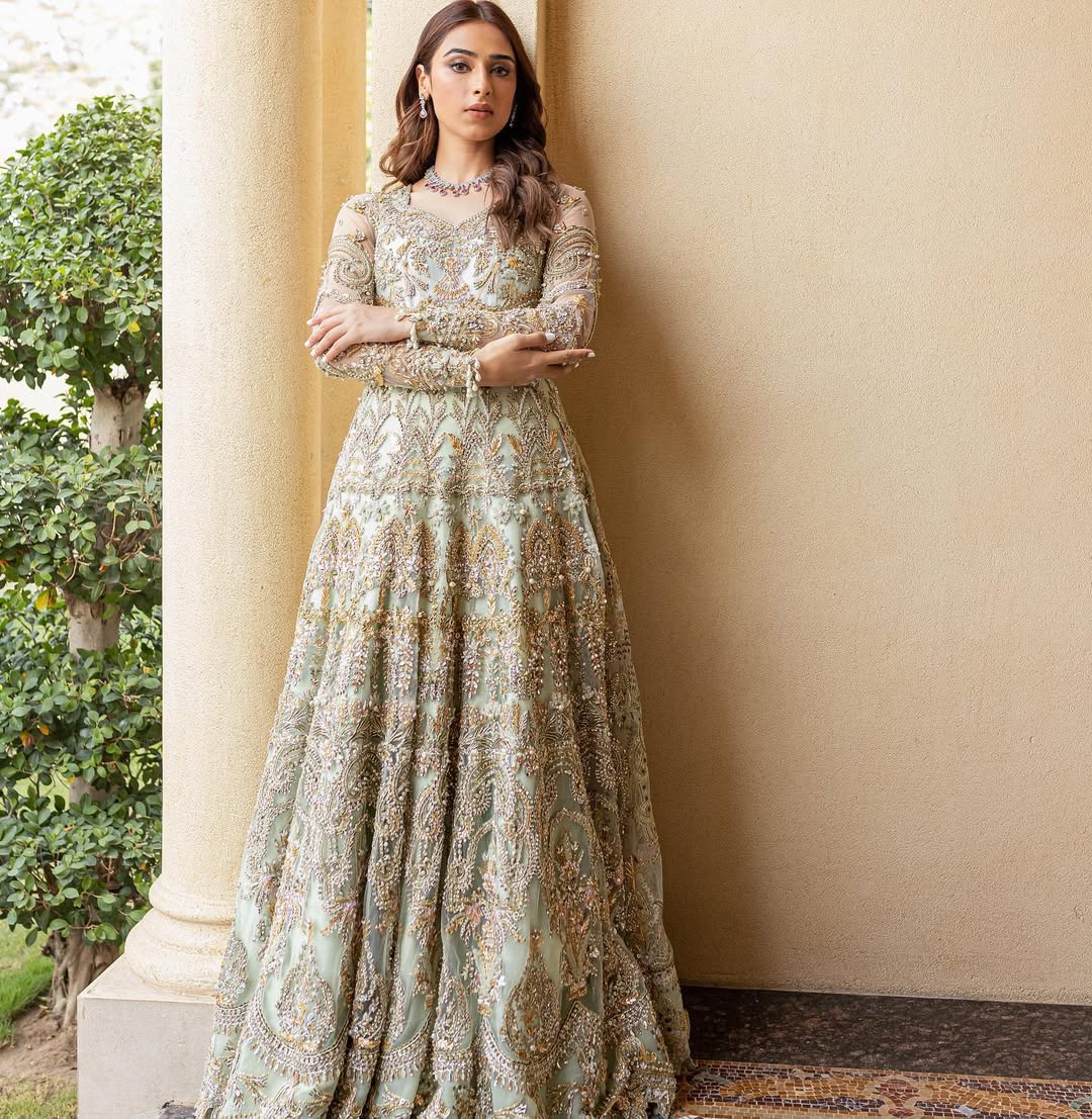 Luxury bridal ensemble Cleo in mint green with pearl embellishments on frock and raw-silk lehenga.