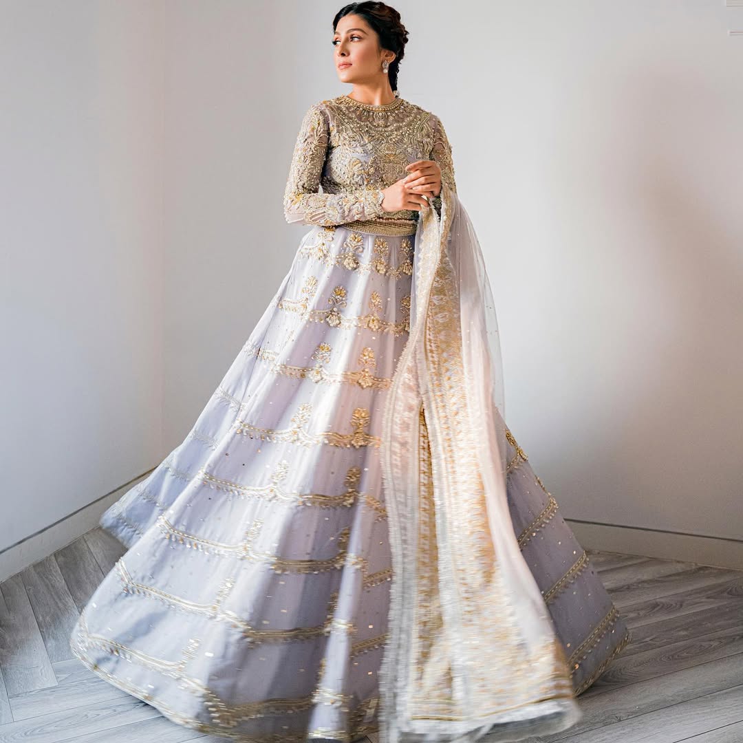 Ayeza Khan wearing Pakistani bridal lehnga in ice-blue with organza choli and net dupatta - Mysie By Tahira