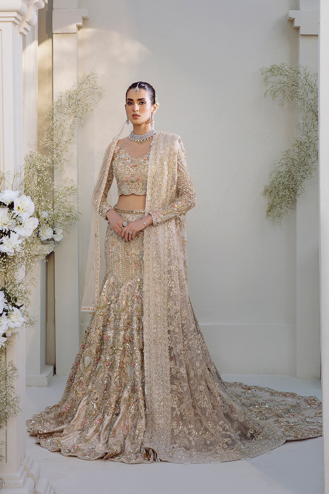 Noorey full pakistani bridal look in net fabric with lehenga, blouse, and dupatta.
