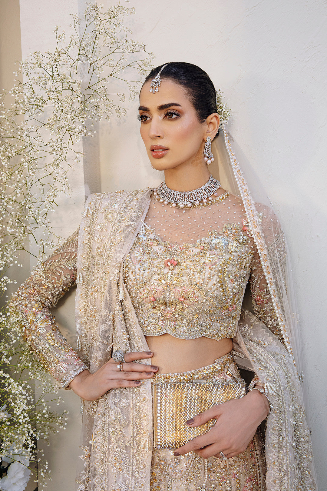 Noorey full pakistani bridal look in net fabric with lehenga, blouse, and dupatta.