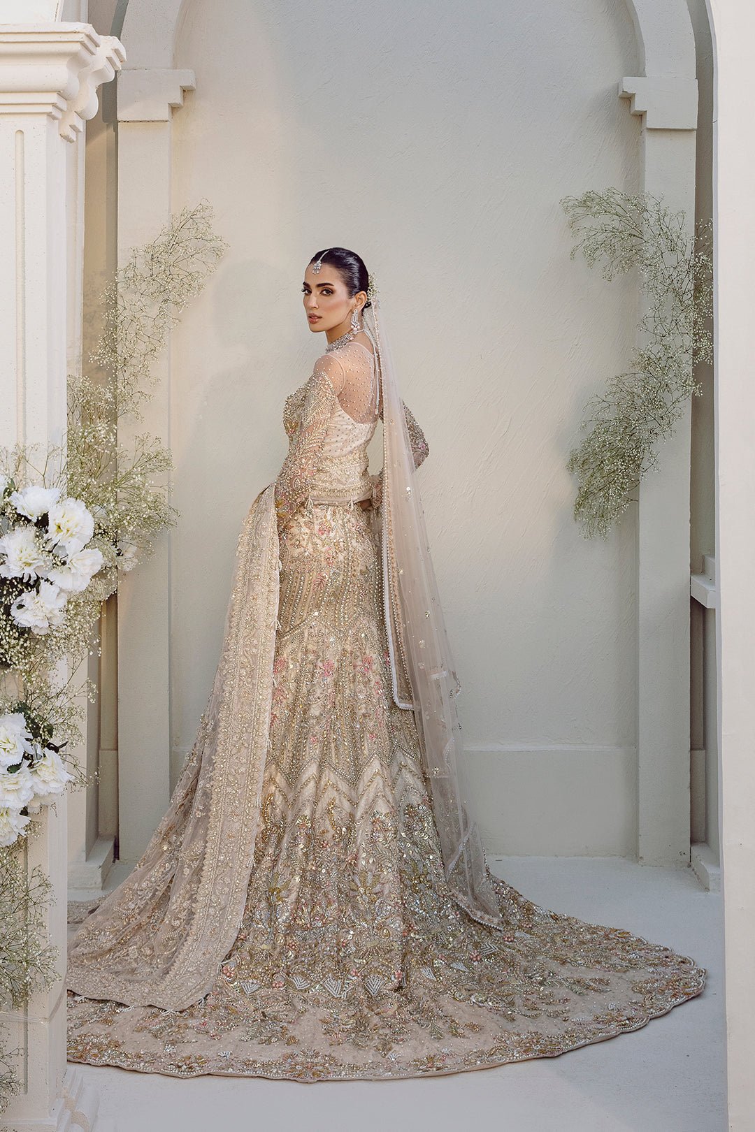 Noorey full pakistani bridal look in net fabric with lehenga, blouse, and dupatta.