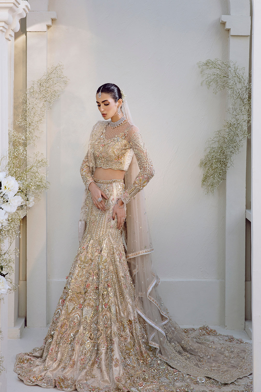 Noorey full pakistani bridal look in net fabric with lehenga, blouse, and dupatta.