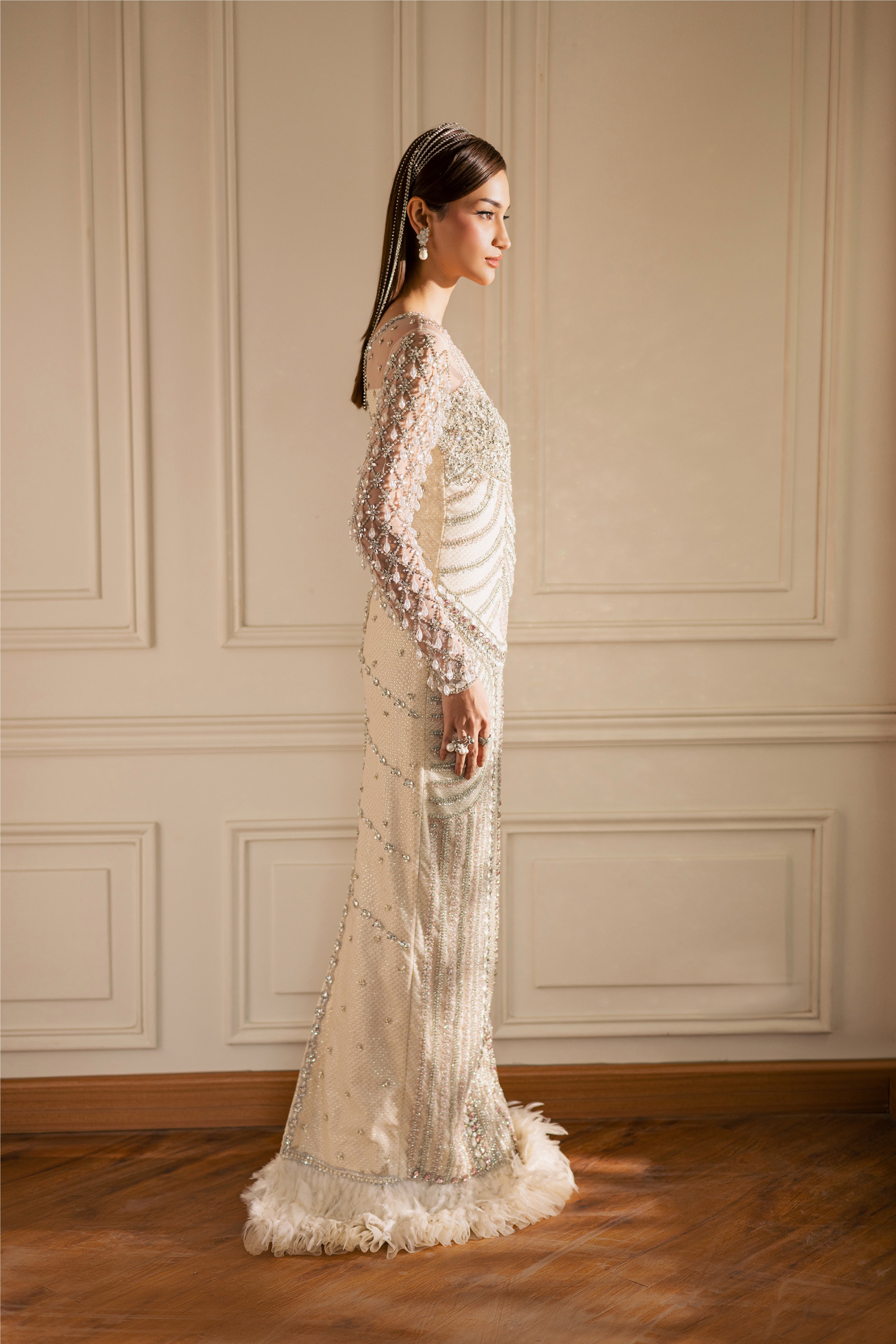 Hand-embellished Opal pearl-white luxury evening gown with sheer sleeves and crystals by Mysie By Tahira.