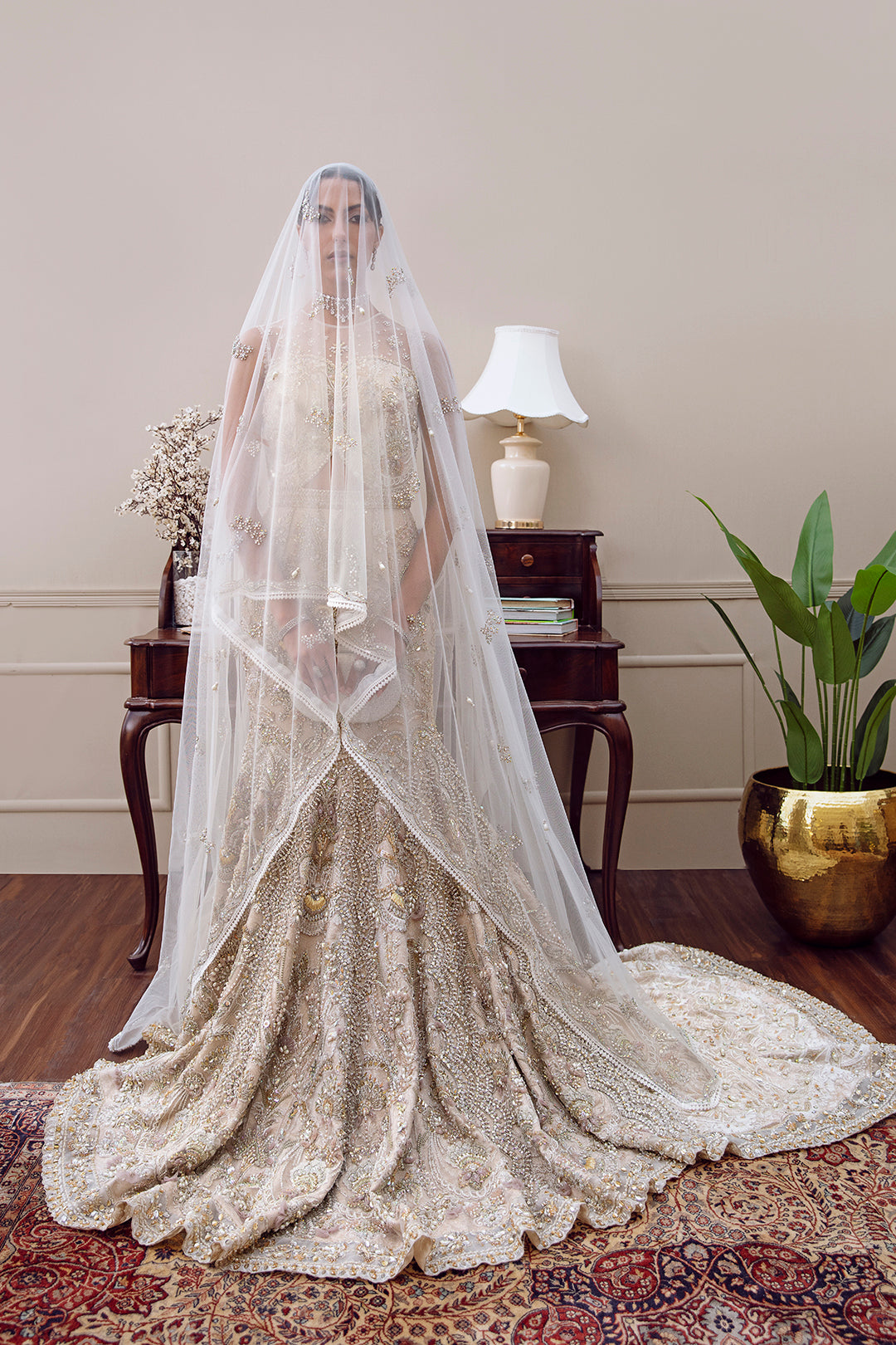 Zevarna bridal lehnga choli in daisy off-white net with pearl and sequin embellishments – Pakistani bridal fashion.