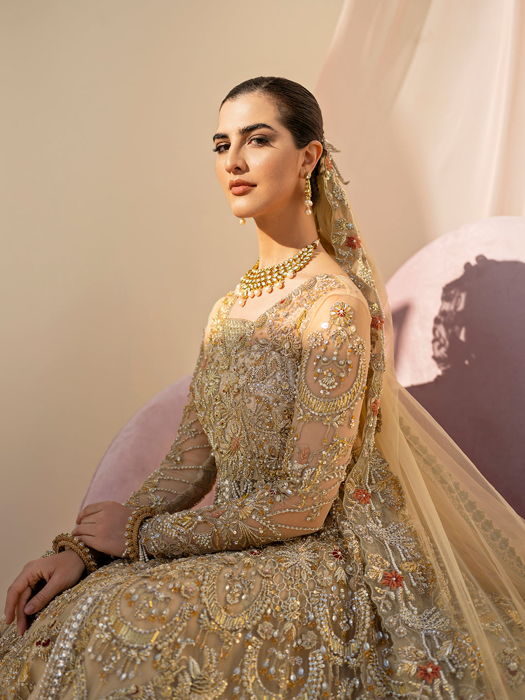 Mahjabeen Pakistani gold bridal gown with hand embroidery and embellished dupatta.