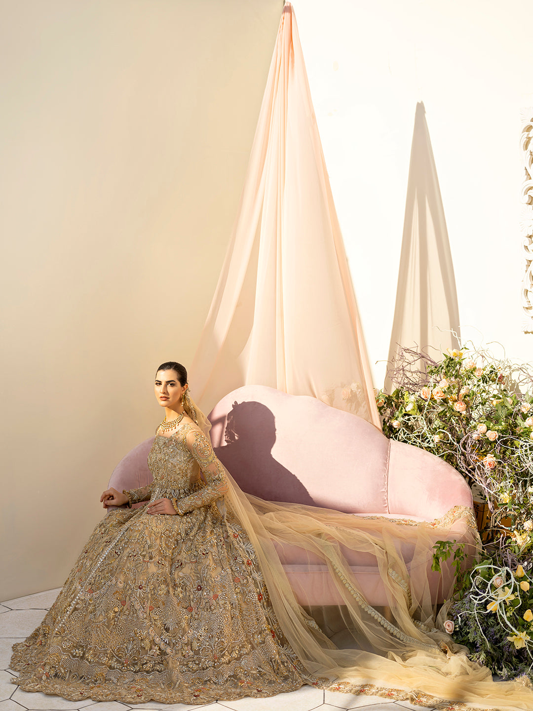 Mahjabeen Pakistani gold bridal gown with hand embroidery and embellished dupatta.