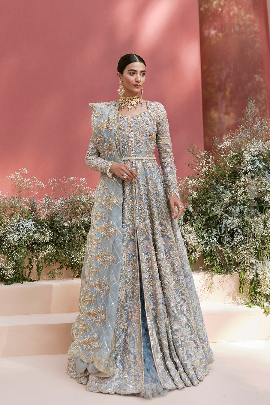 Pieta luxury Pakistani bridal outfit in ice blue organza with delicate embroidery and gold detailing.