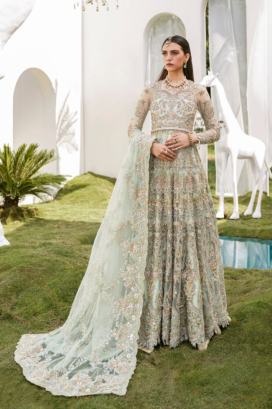 Luxury bridal ensemble Cleo in mint green with pearl embellishments on frock and raw-silk lehenga.