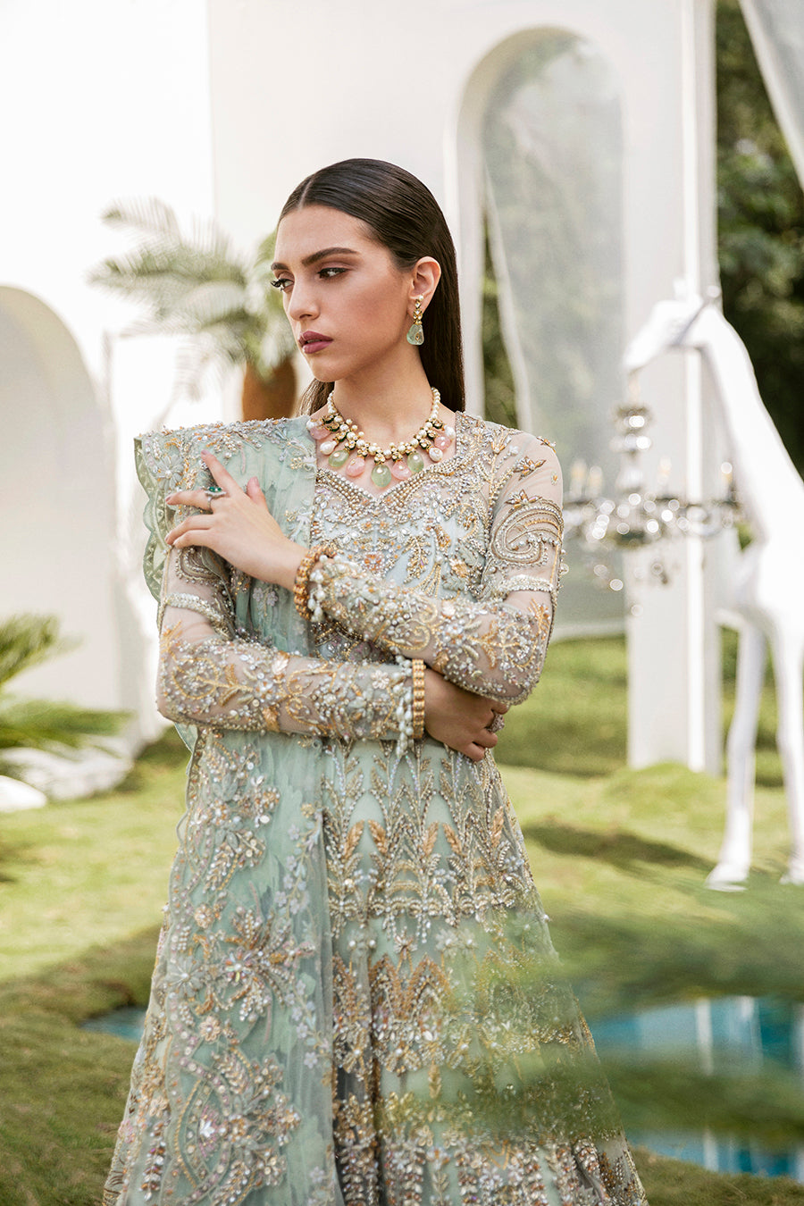 Luxury bridal ensemble Cleo in mint green with pearl embellishments on frock and raw-silk lehenga.