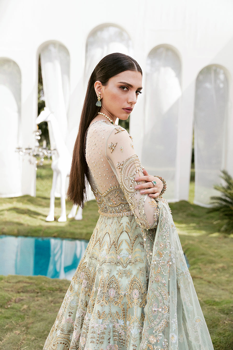 Luxury bridal ensemble Cleo in mint green with pearl embellishments on frock and raw-silk lehenga.