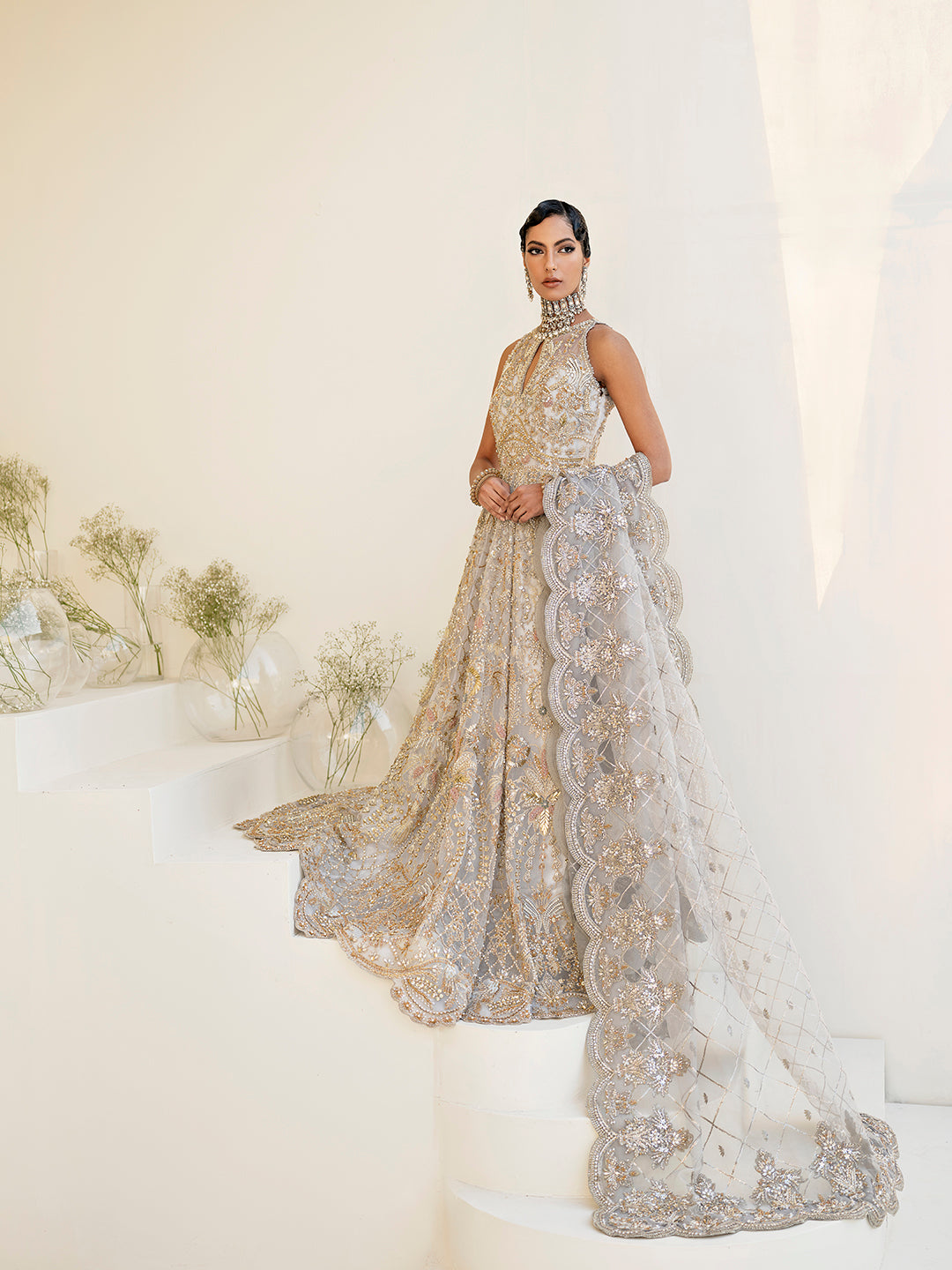 Pakistani bridal outfit Taara in ice-blue organza with gold floral embellishments.
