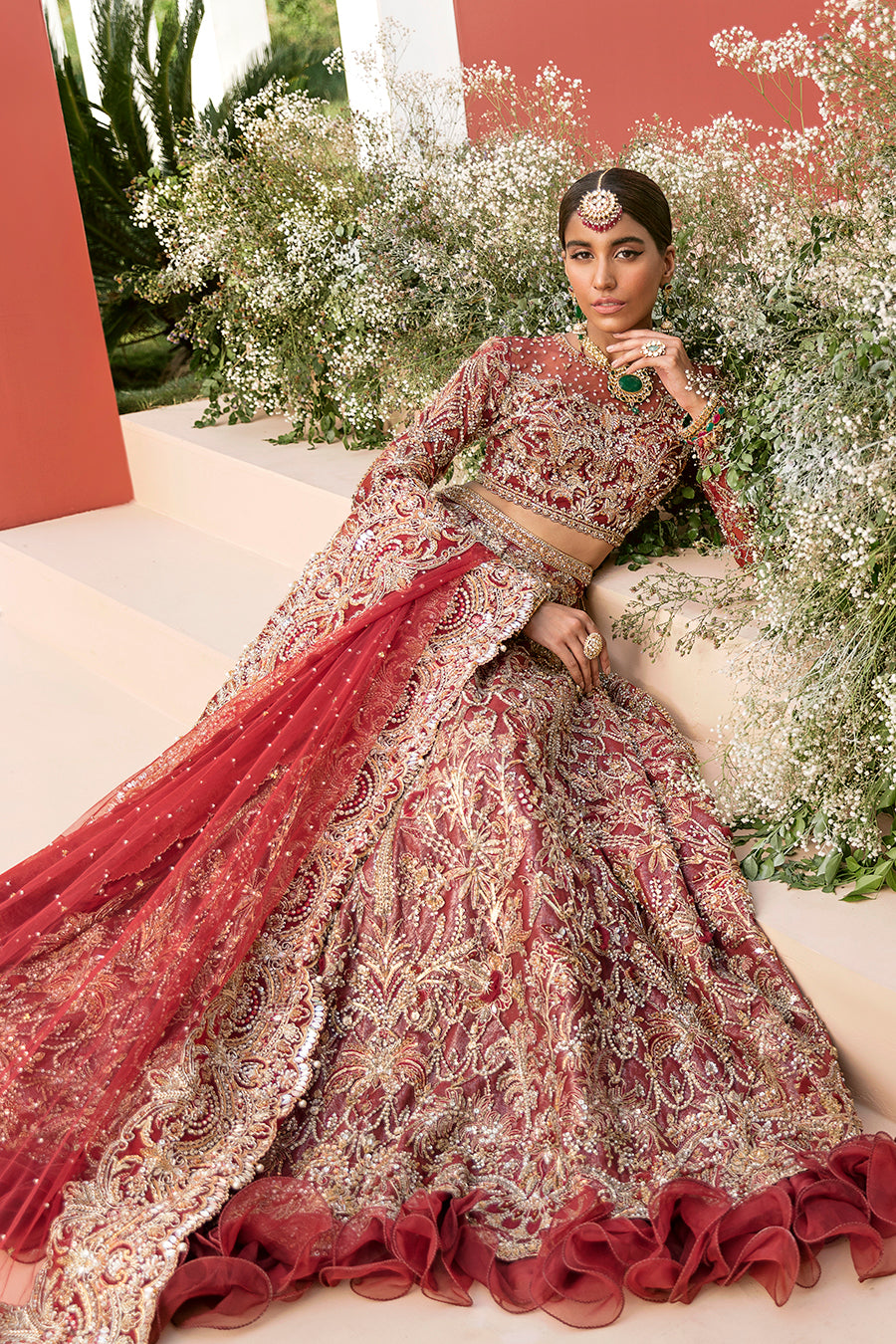 Luxury bridal lehnga choli in deep red with gold details by Mysie by Tahira