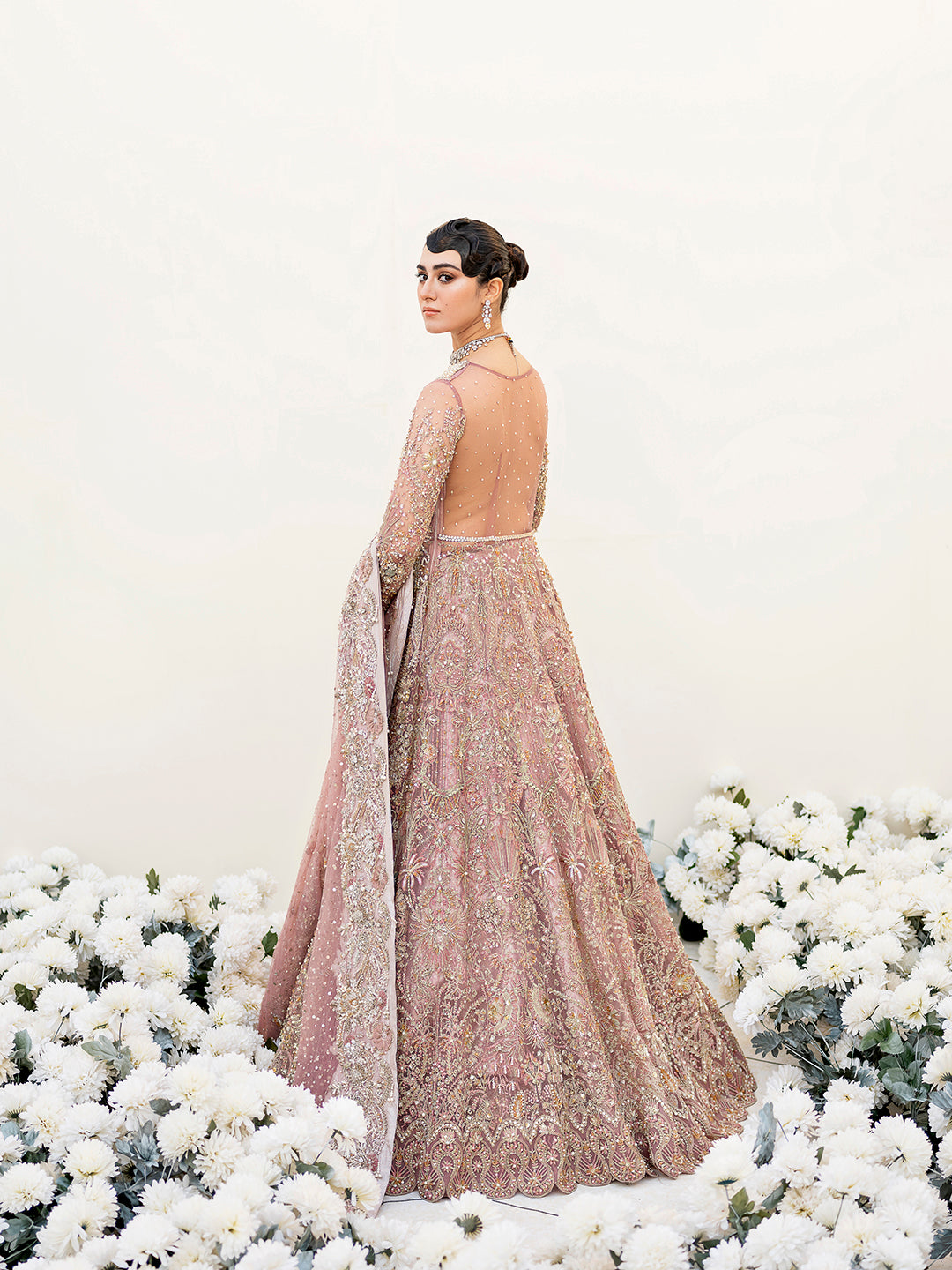 Sereena Pakistani bridal peshwas in lilac net with ice blue and gold embellishments.